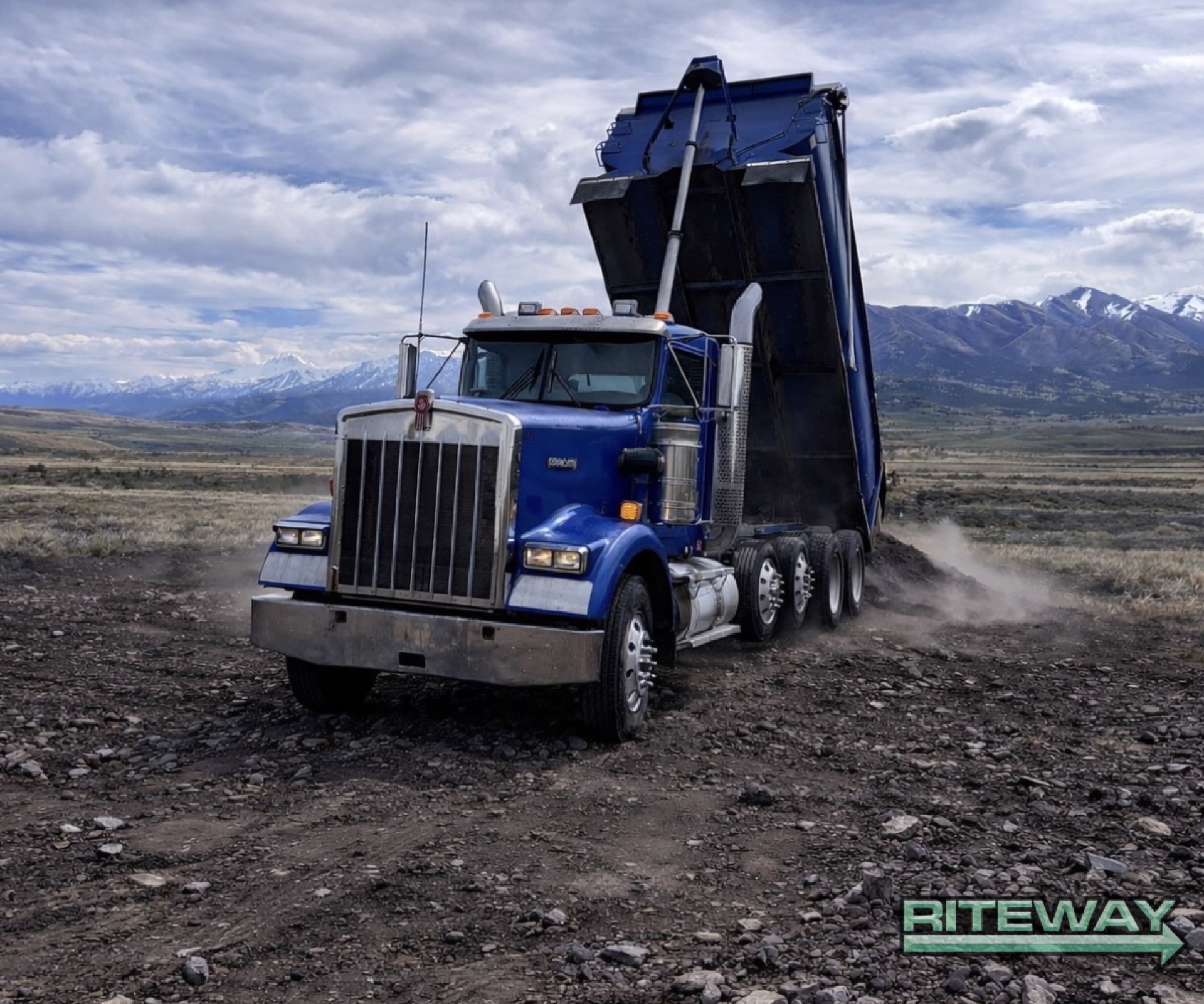 Riteway dump truck hauling a gravel delivery load